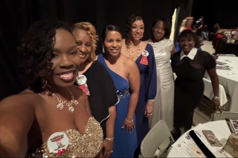 Members in evening gowns at a formal gala celebration