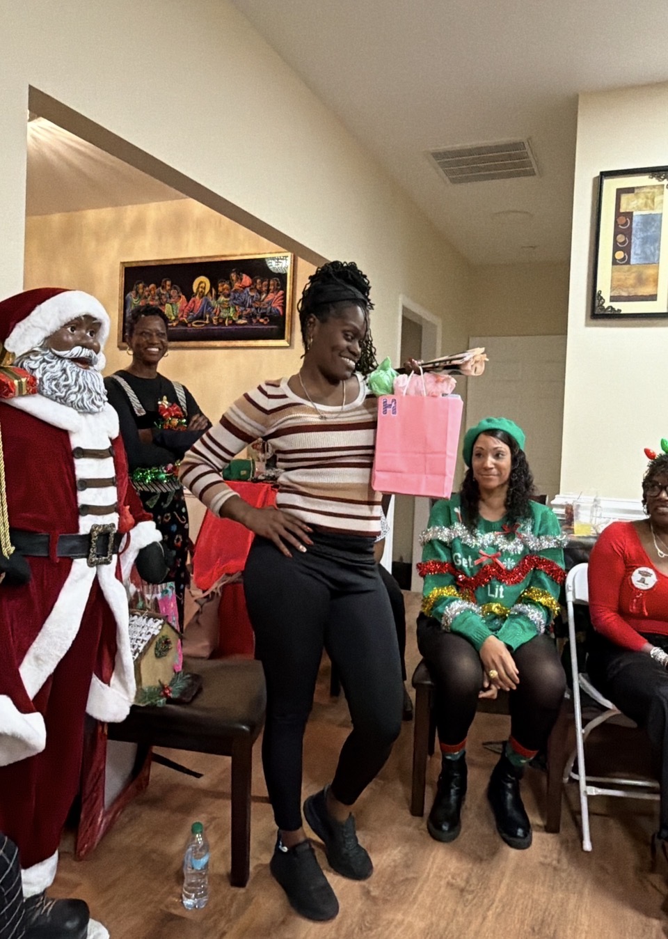 Member showing off her gift exchange prize at the holiday gathering