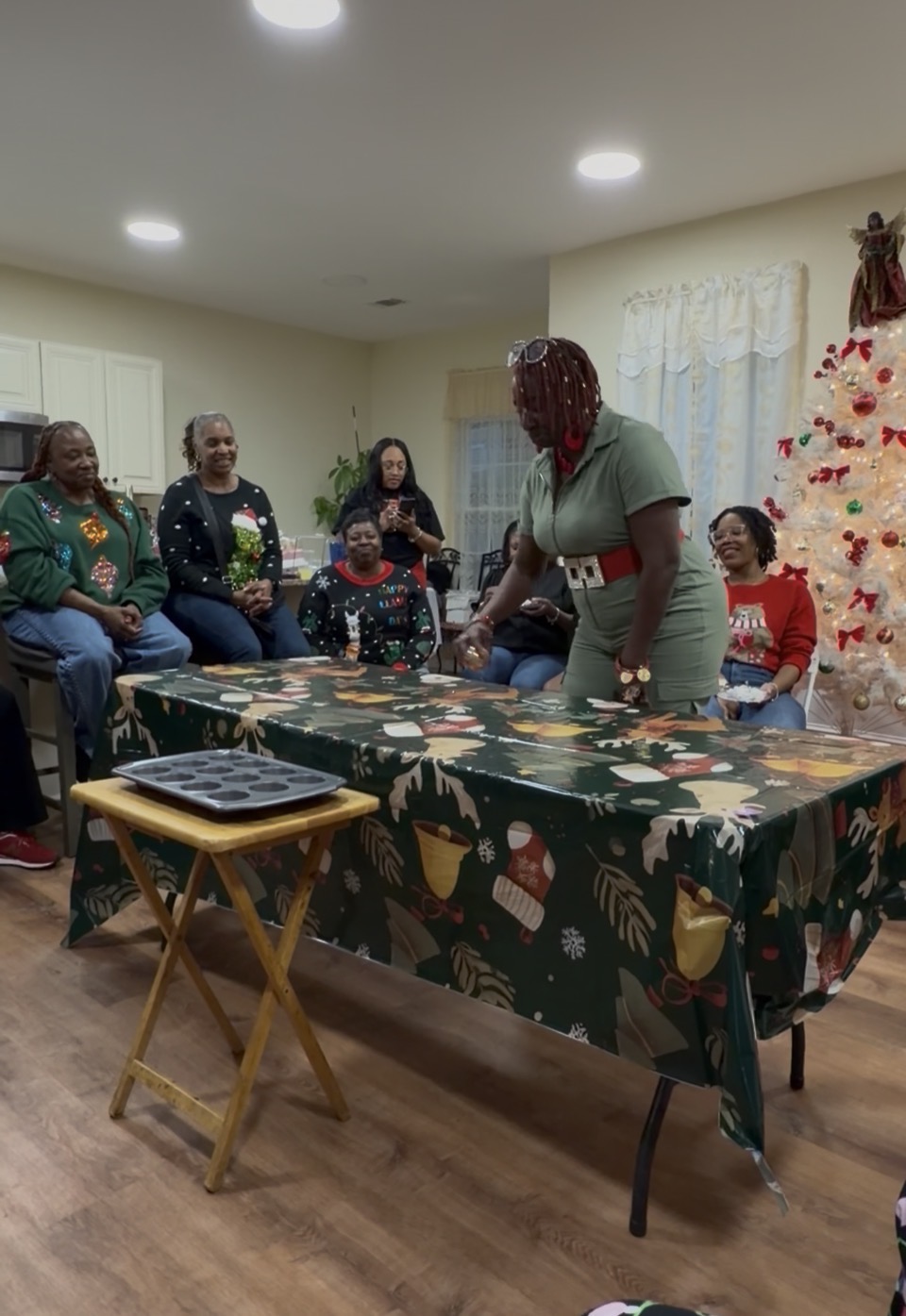 Members gathered around the table at the holiday cookie exchange