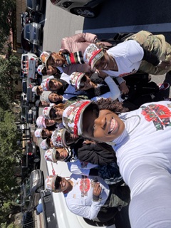 Group selfie of members bundled up before the Veteran's Day Parade
