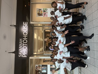Members posing outside Savannah Photohouse after a photo session
