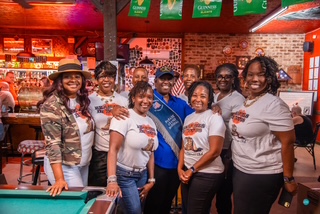 Members posing together at a community social event