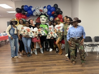 Members at the Pirate-themed community event with balloon arch