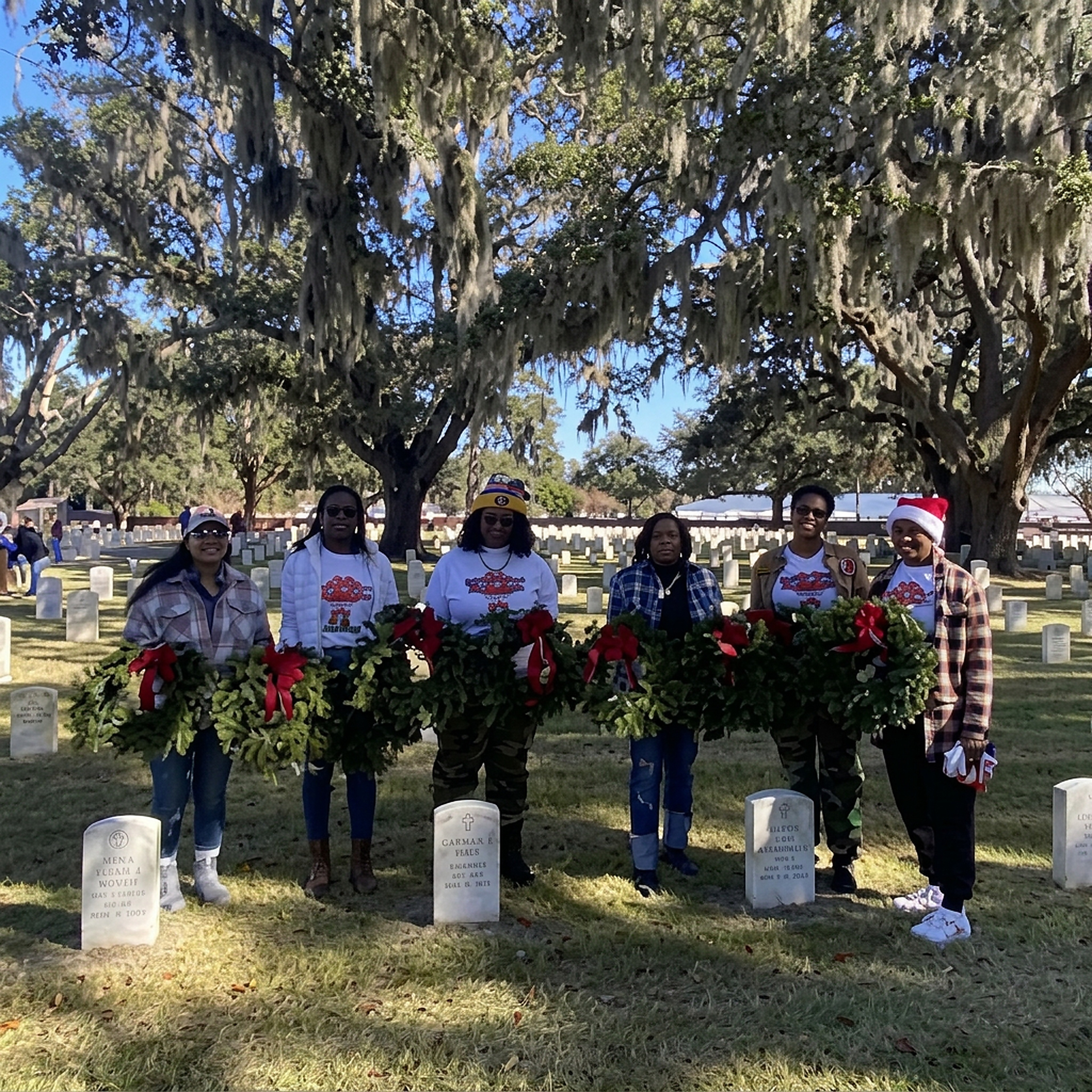 Members with wreaths at the cemetery for Wreaths Across America