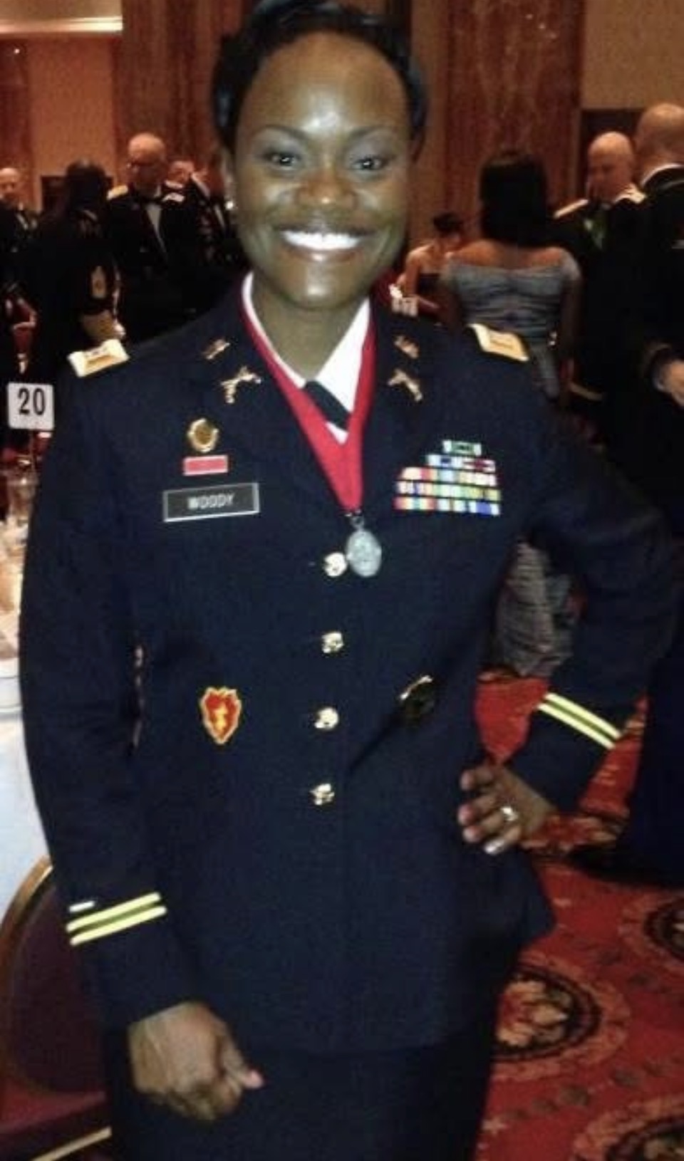 Captain Nathacha Rock in dress uniform at a military ball