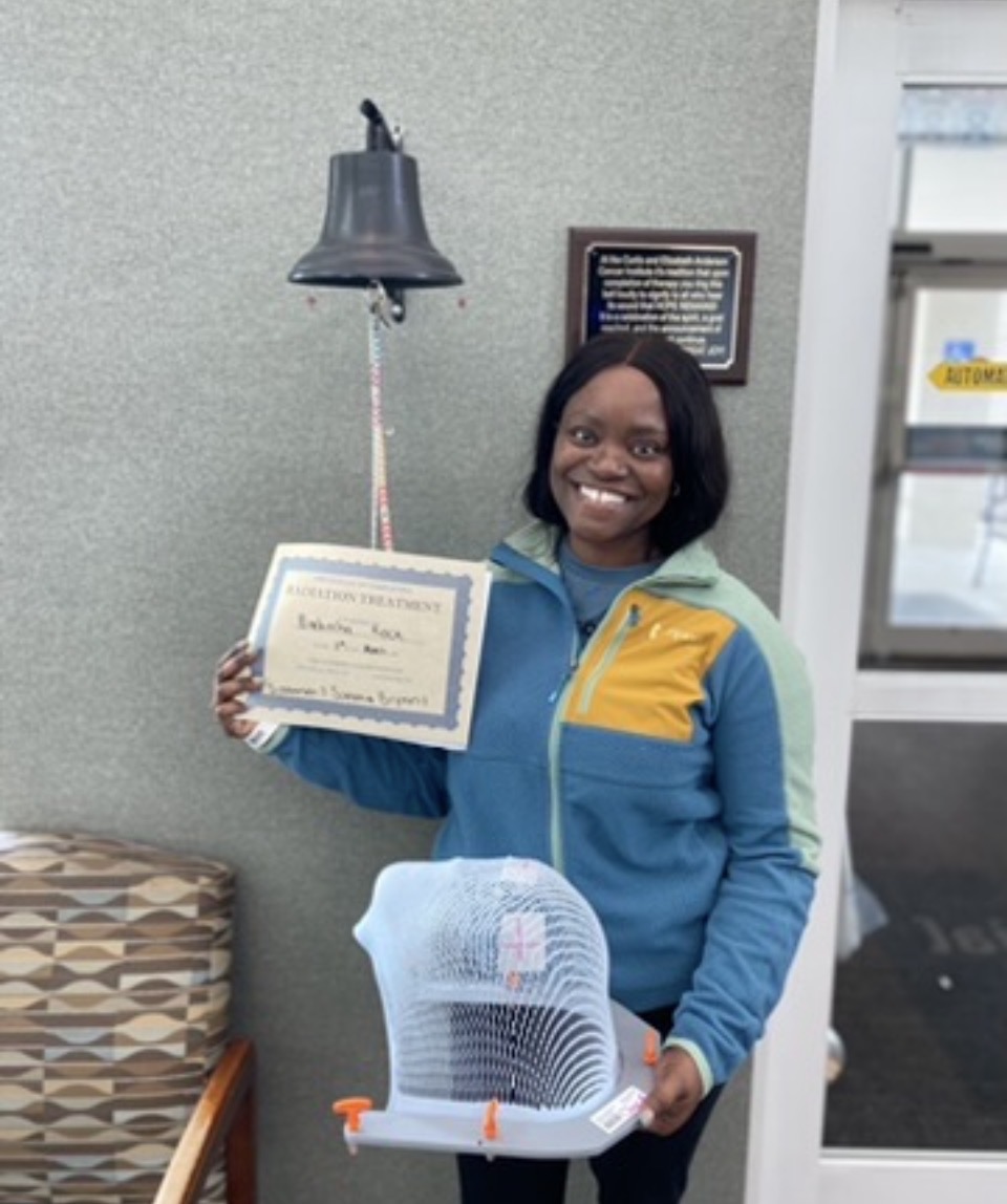 Captain Nathacha Rock ringing the bell after radiation treatment