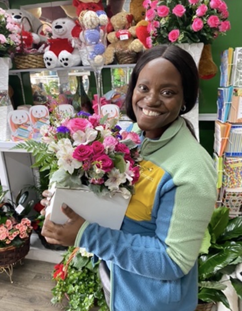Captain Nathacha Rock holding a bouquet of flowers