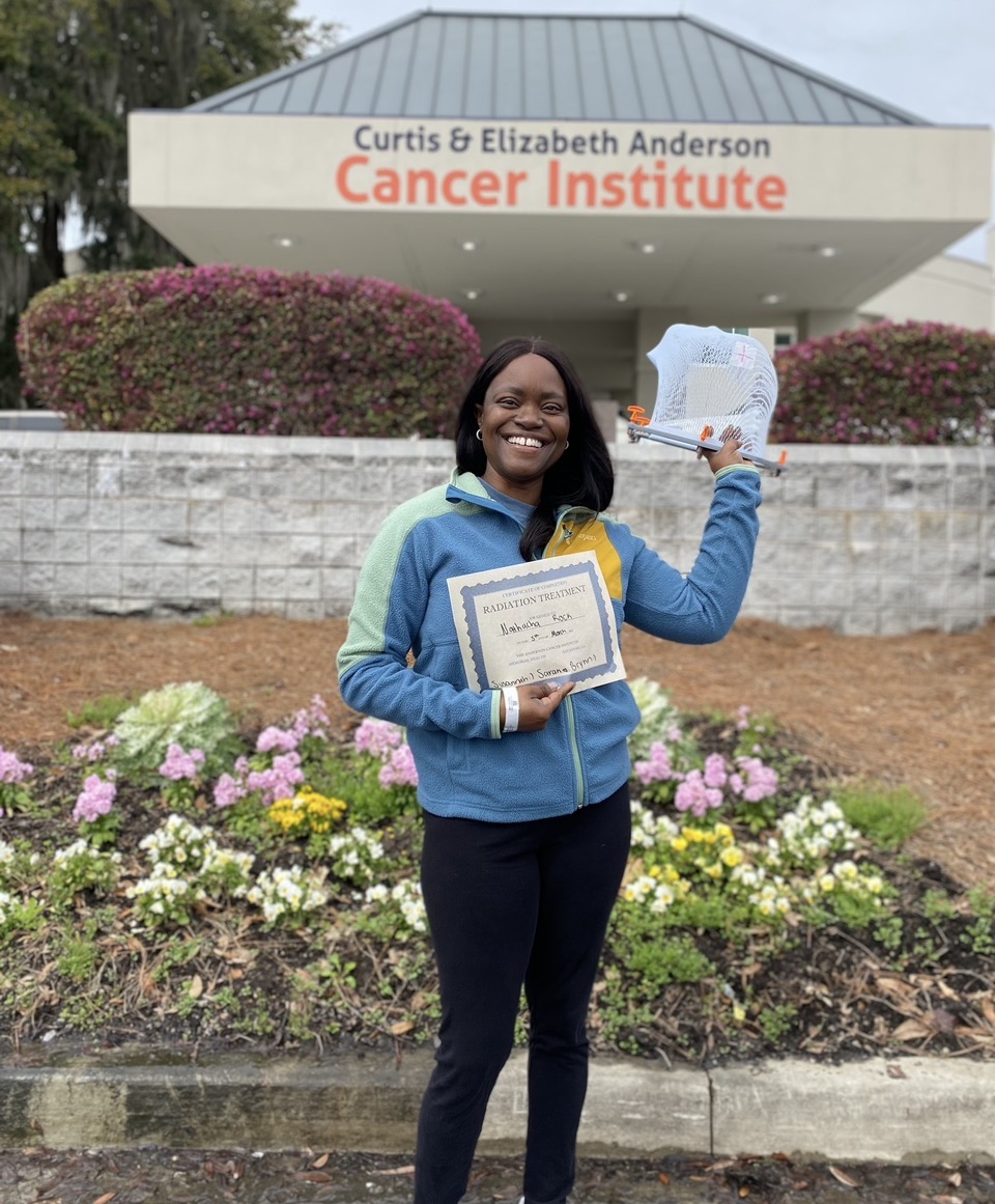 Captain Nathacha Rock outside the Curtis & Elizabeth Anderson Cancer Institute